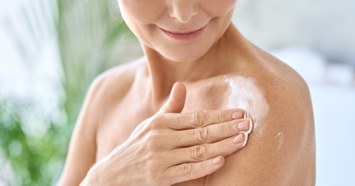 Woman Applying Body Cream